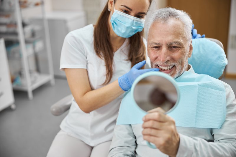 Dentist treating adult patient